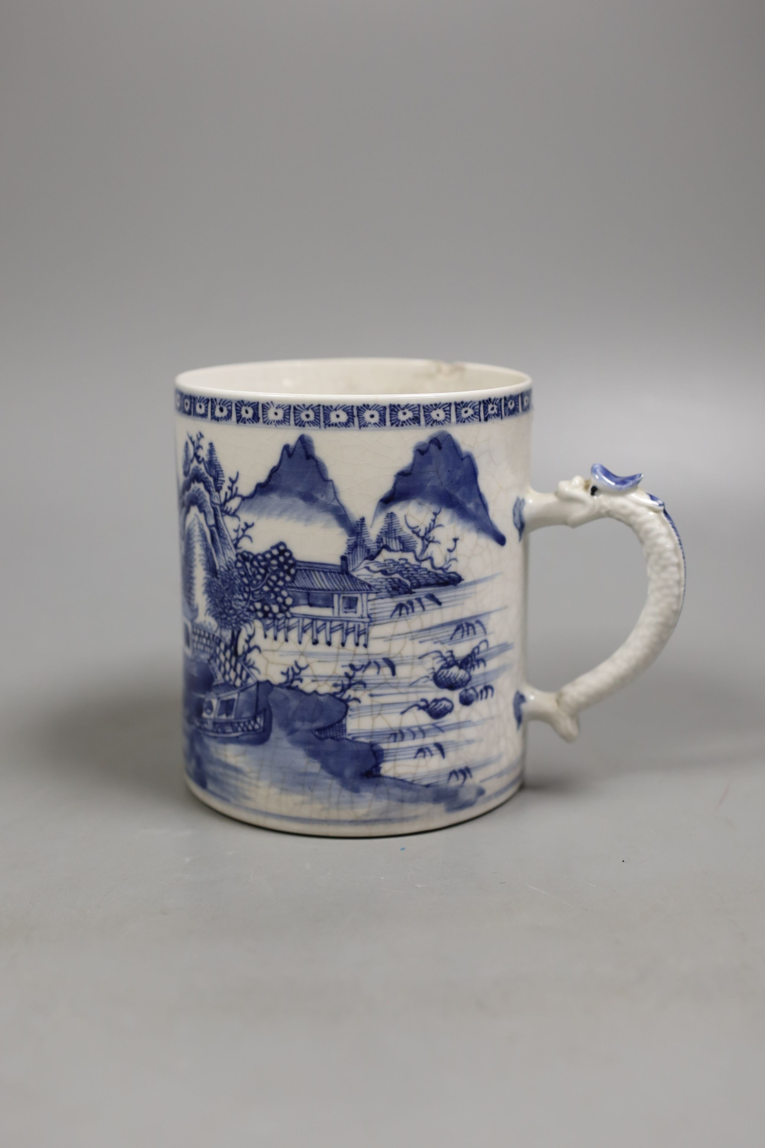 A Chinese blue and white mug, late 18th century, 11.5 cms high.